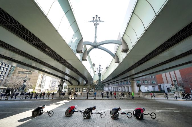 Competitors race in the Men's Elite wheelchair group of the Tokyo Marathon on March 1.