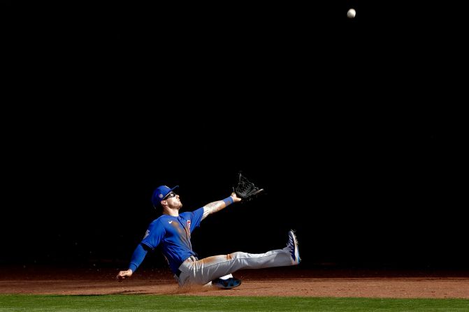 Chicago Cubs right fielder Ian Miller misses a fly foul ball during the fifth inning of a spring training game against the Texas Rangers on February 27.