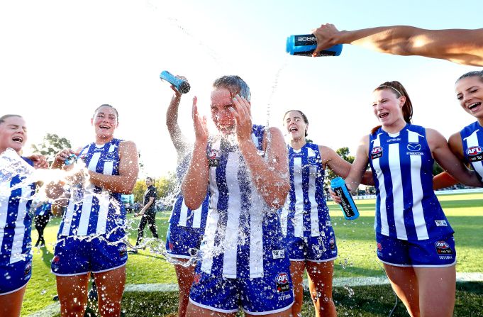 Mia King of the Kangaroos celebrates victory with teammates during the round four AFLW match between the North Melbourne Kangaroos and the Gold Coast Suns on February 29 in Melbourne, Australia.