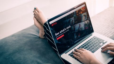 A Netflix user visits the streaming service on a laptop in this undated stock image.