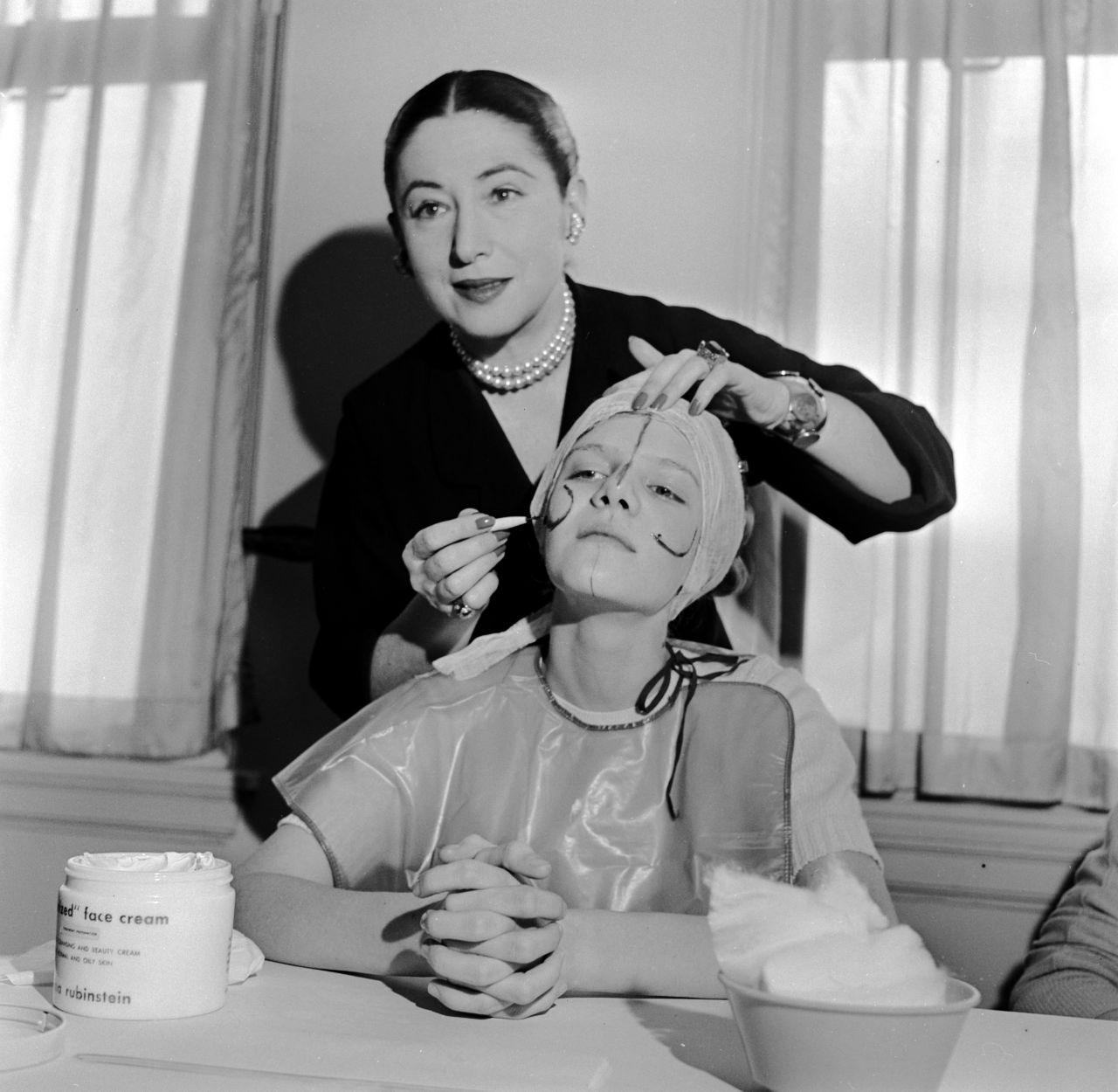 Beauty expert Helena Rubinstein illustrating how make-up can be applied to flatter individual contours (c. 1935)