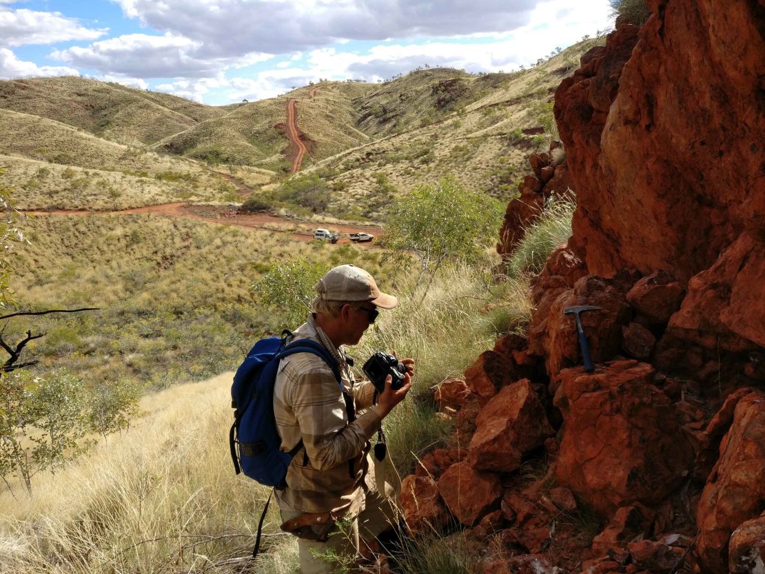 Benjamin Johnson inspects rock at Panorama. This was once an ancient hydrothermal vent.