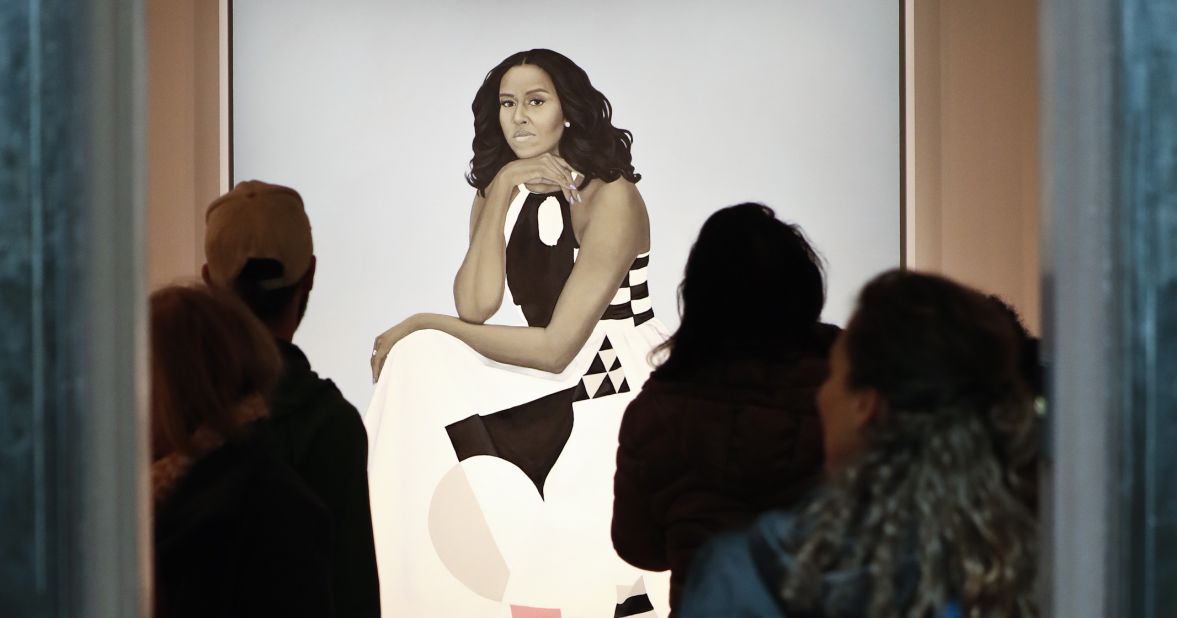 Visitors encounter Amy Sherald's official portrait of Michelle Obama at the National Portrait Gallery in 2018.