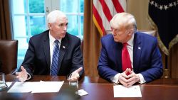 US President Donald Trump and Vice President Mike Pence (L), along with members of the coronavirus take force meet with pharmaceutical executives in the Cabinet Room of the White House in Washington, DC on March 2, 2020.