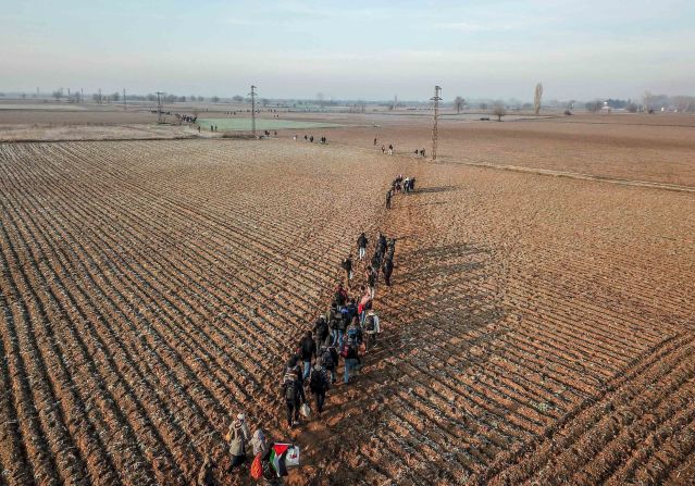 Migrants walk toward the Greek border near Pazarkule, Turkey, on March 1.