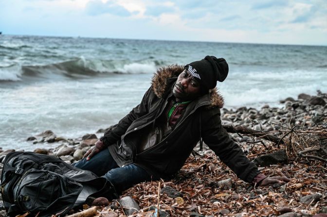 A man rests after surviving the crossing between Turkey and Greece on February 29.