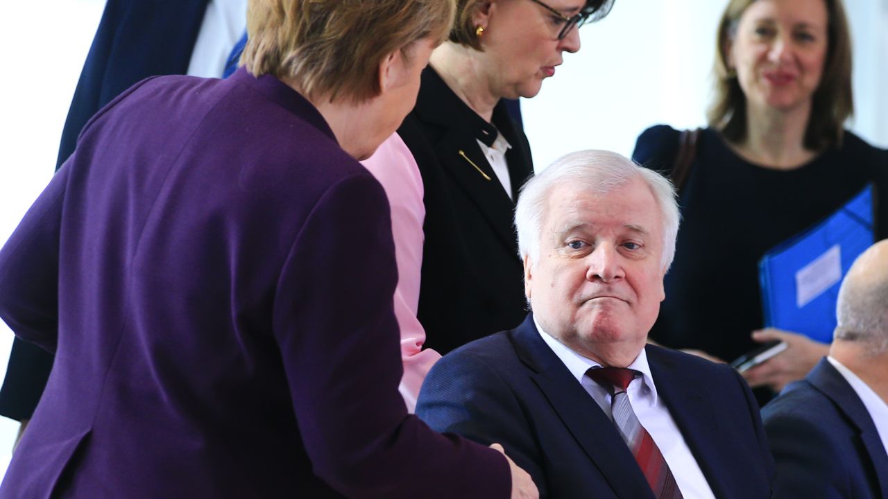 German Interior Minister Horst Seehofer refuses shaking hands with German Chancellor Angela Merkel in Berlin, Germany on March 2, due to the spread of coronavirus.