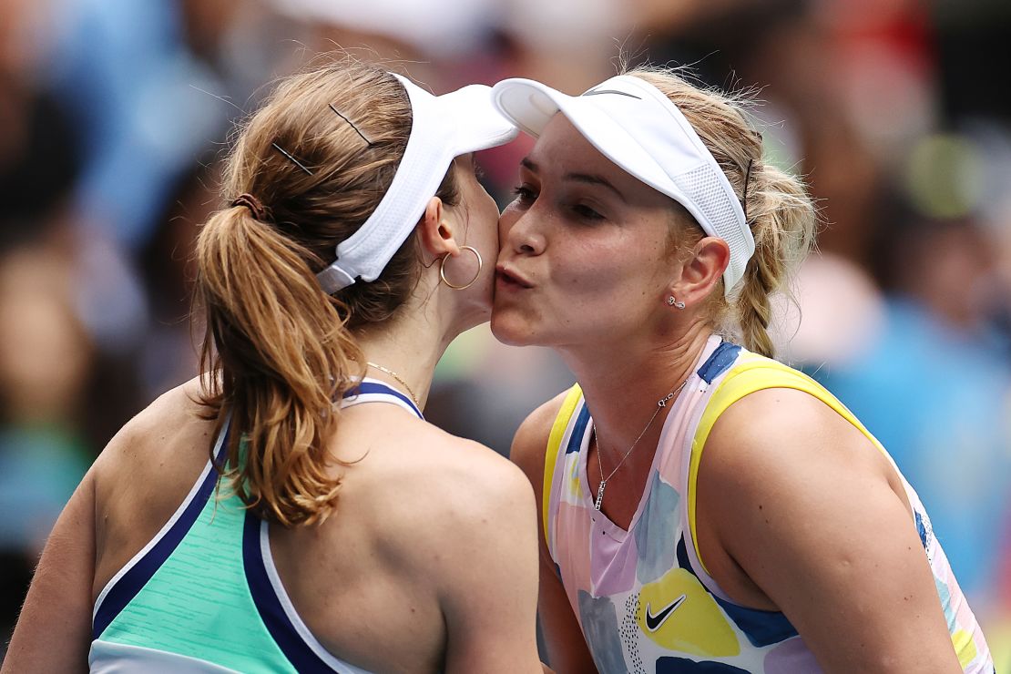 Donna Vekic kisses Alize Cornet on the cheek as they meet at the 2020 Australian Open in January.