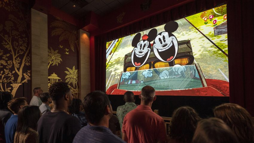 Guests watch a new "Mickey Mouse" cartoon short, "Perfect Picnic," to begin their Mickey & Minnie's Runaway Railway experience. Things go awry, the screen explodes, and you enter the cartoon world through the blast hole. 