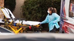 SEATTLE, WA - FEBRUARY 29: A healthcare worker prepares to transport a patient on a stretcher into an ambulance at Life Care Center of Kirkland on February 29, 2020 in Kirkland, Washington. Dozens of staff and residents at Life Care Center of Kirkland are reportedly exhibiting coronavirus-like symptoms, with two confirmed cases of (COVID-19) associated with the nursing facility reported so far. (Photo by David Ryder/Getty Images)
