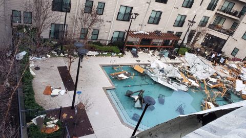 Storm debris is strewn across an apartment swimming pool in the Germantown area of Nashville.