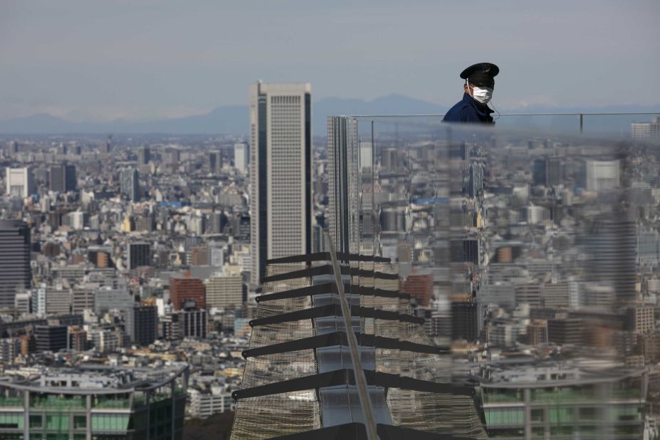 A security guard stands on the Shibuya Sky observation deck in Tokyo on March 3.