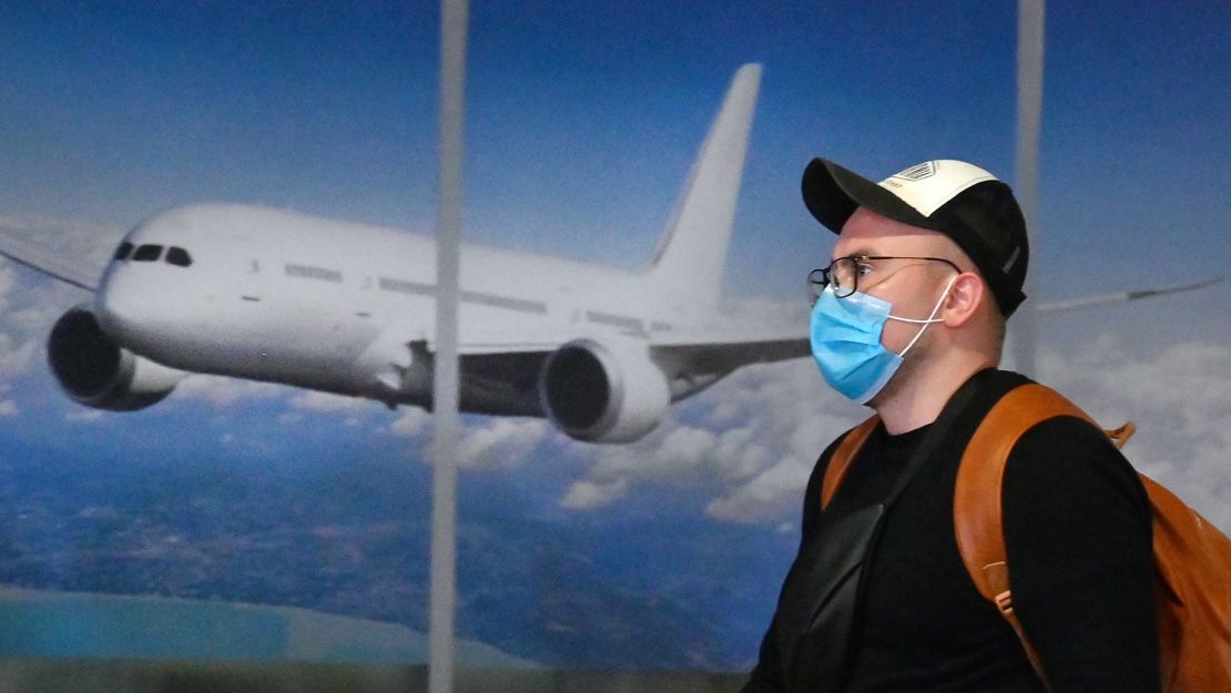 On January 20, a masked traveler arrives in Kiev after flying in from China.