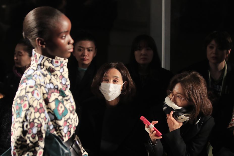 Spectators wear protective masks during Isabel Marant Autumn/Winter 2020/21 in Paris