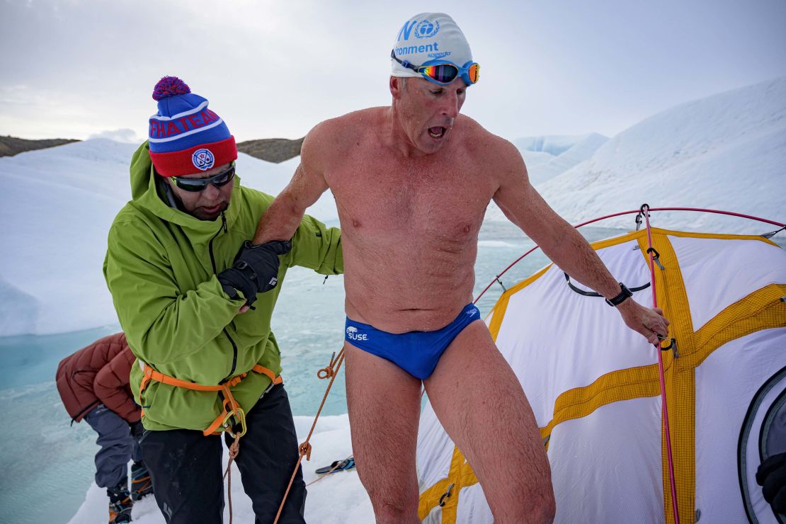 Pugh is helped out of the water by close friend and ice hockey great Slava Fetisov. 