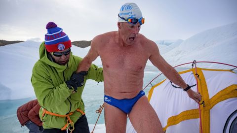 Pugh is helped out of the water by close friend and ice hockey great Slava Fetisov. 