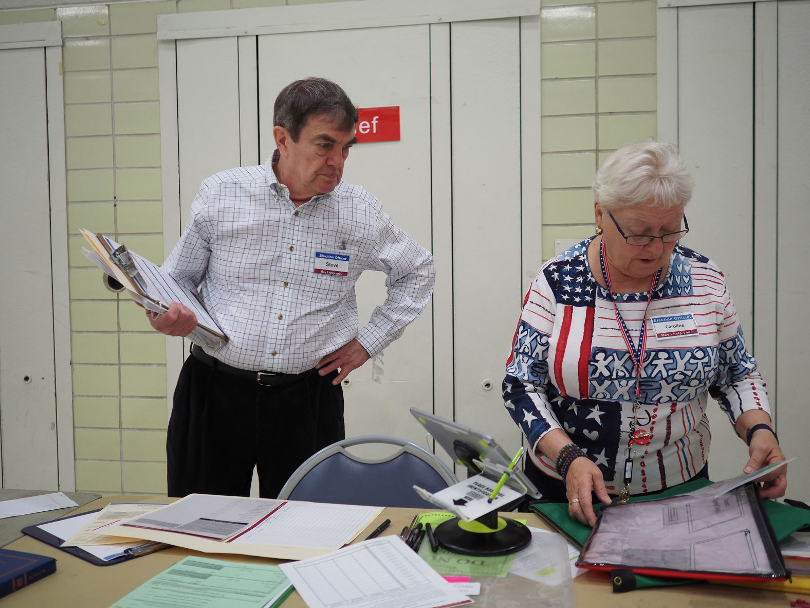 Election officials in Arlington, Virginia, prepare to open the polls on Tuesday.