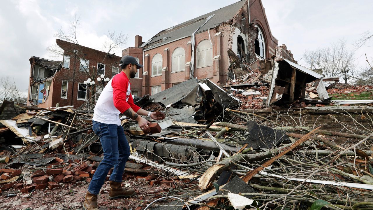 Sumant Joshi helps to clean up rubble at a Nashville church Tuesday. 