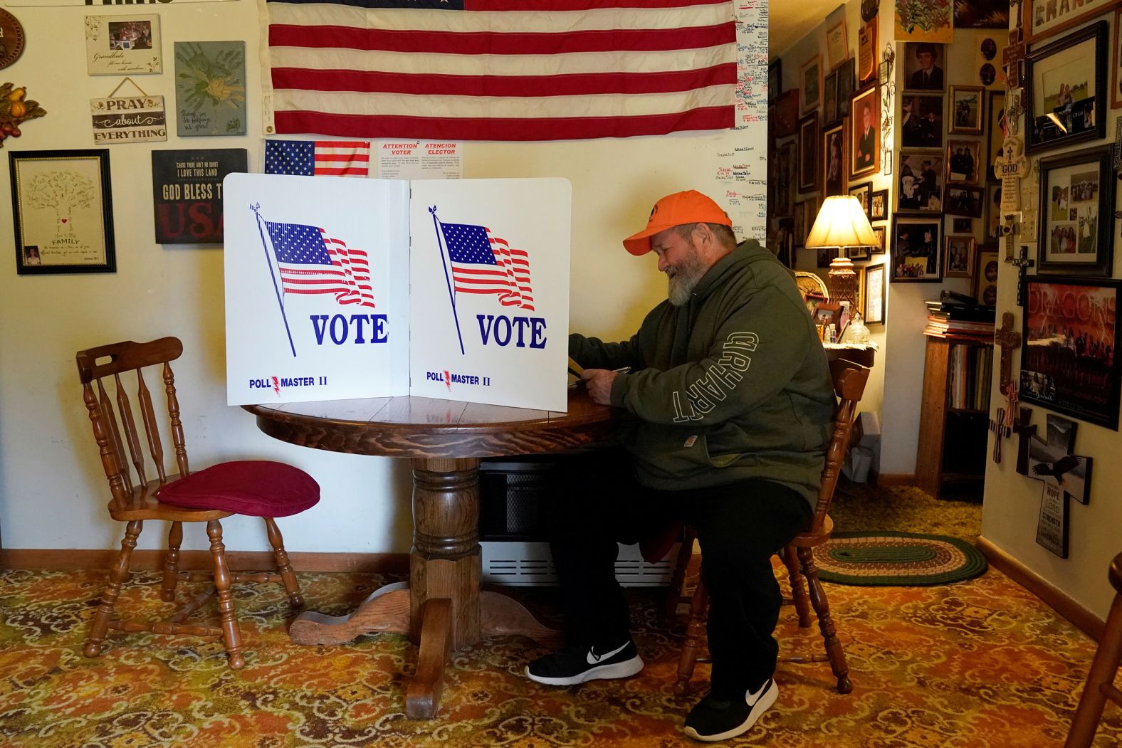 James "Pudge" Brown fills out his ballot in Linda Been's dining room in Tiger Mountain, Oklahoma. The Been family has operated a polling place on their property for over 100 years.