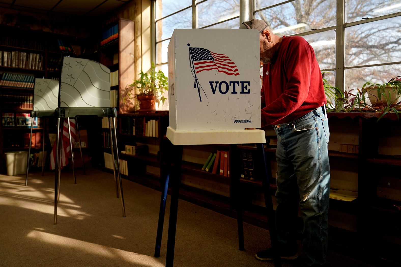 Percy C. Wade III fills out his ballot at a school library in Weleetka, Oklahoma.