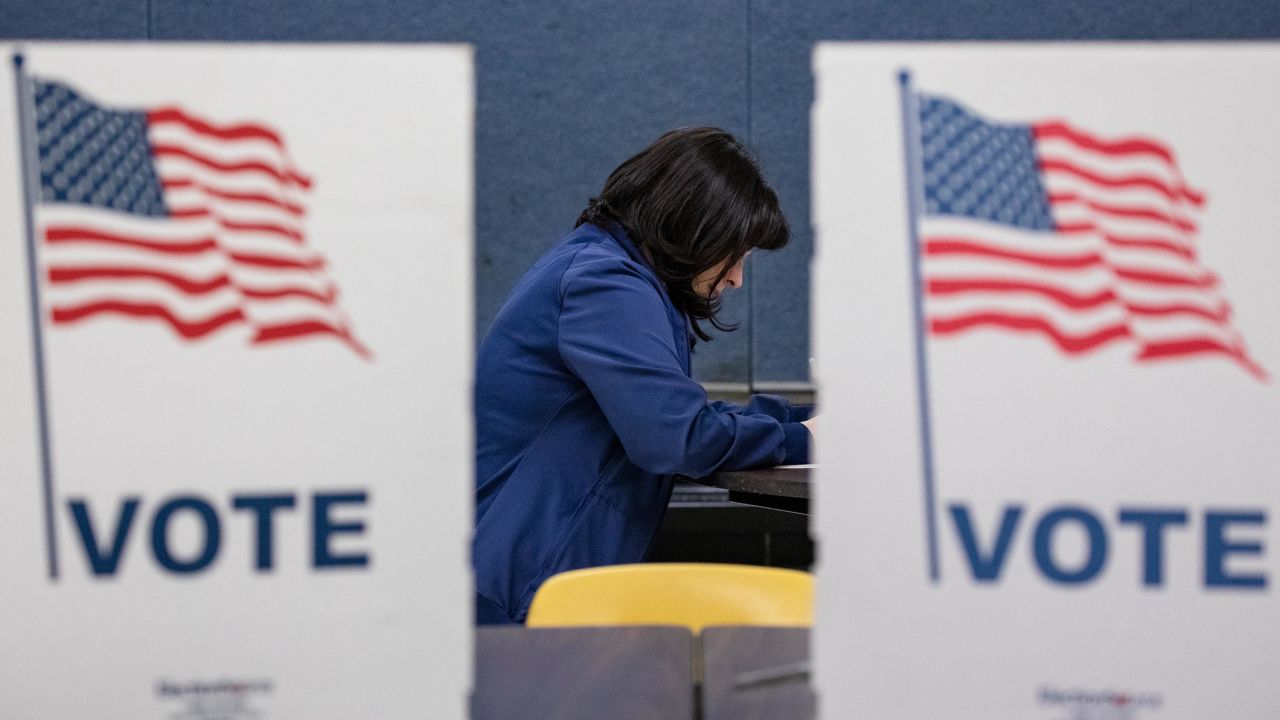 A voter fills in her ballots for the Democratic presidential primary election at a polling place in Armstrong Elementary School on Super Tuesday, March 3, 2020 in Herndon, Virginia. 