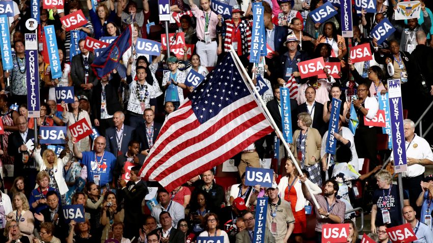 PHILADELPHIA, PA - JULY 28:  Delegates stand and cheer on the fourth day of the Democratic National Convention at the Wells Fargo Center, July 28, 2016 in Philadelphia, Pennsylvania. Democratic presidential candidate Hillary Clinton received the number of votes needed to secure the party's nomination. An estimated 50,000 people are expected in Philadelphia, including hundreds of protesters and members of the media. The four-day Democratic National Convention kicked off July 25.  (Photo by Win McNamee/Getty Images)
