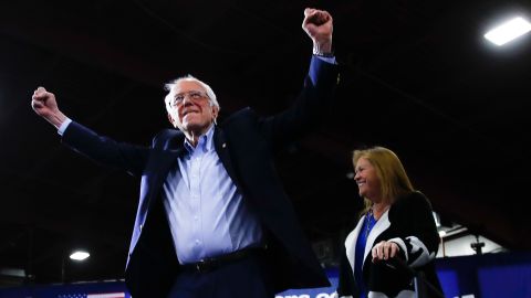 Sanders accompanied by his wife Jane O'Meara Sanders, arrives to speak during a primary night election rally in Essex Junction, Vt., Tuesday, March 3, 2020.