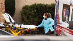 SEATTLE, WA - FEBRUARY 29: A healthcare worker prepares to transport a patient on a stretcher into an ambulance at Life Care Center of Kirkland on February 29, 2020 in Kirkland, Washington. Dozens of staff and residents at Life Care Center of Kirkland are reportedly exhibiting coronavirus-like symptoms, with two confirmed cases of (COVID-19) associated with the nursing facility reported so far. (Photo by David Ryder/Getty Images)