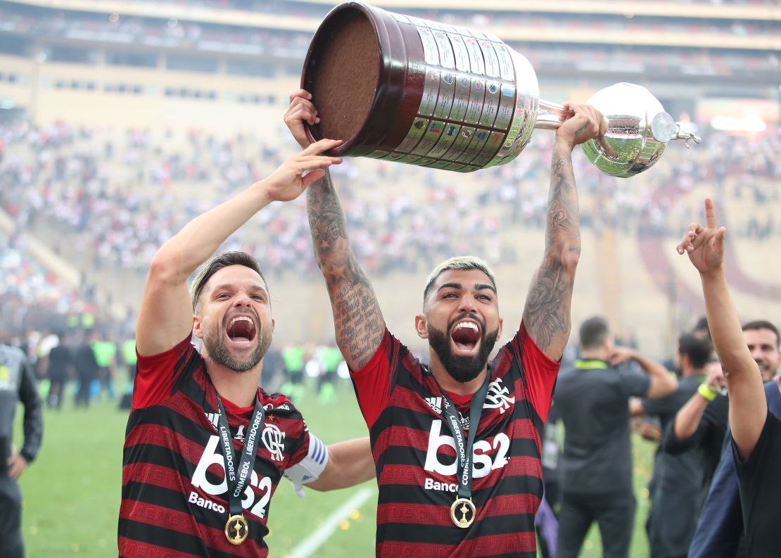 Gabriel Barbosa lifts the Copa Libertadores trophy after his two late goals beat River Plate.