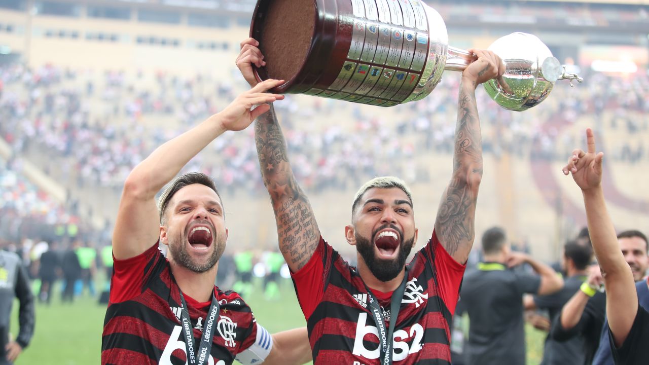Gabriel Barbosa lifts the Copa Libertadores trophy after his two late goals beat River Plate.