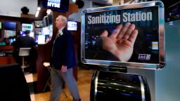 A trader passes a hand sanitizing station on the floor of the New York Stock Exchange, Tuesday, March 3, 2020. Federal Reserve Chairman Jerome Powell noted that the coronavirus "poses evolving risks to economic activity." (AP Photo/Richard Drew)