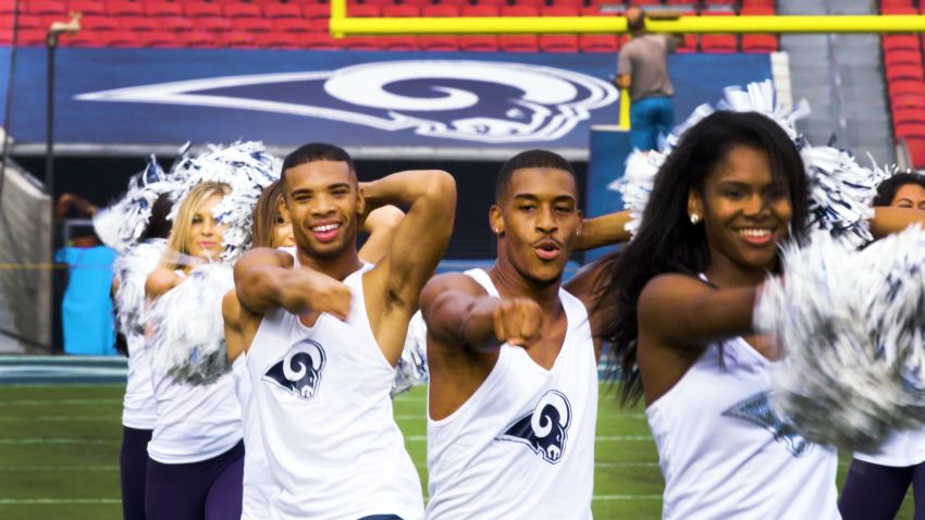 Professional dancers Quinton Peron and Napoleon Jinnies made history when they became the NFL's first male cheerleaders.