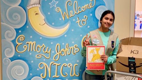Anoushka Talwar delivers books to the NICU at the Emory John's Creek Hospital in Georgia.