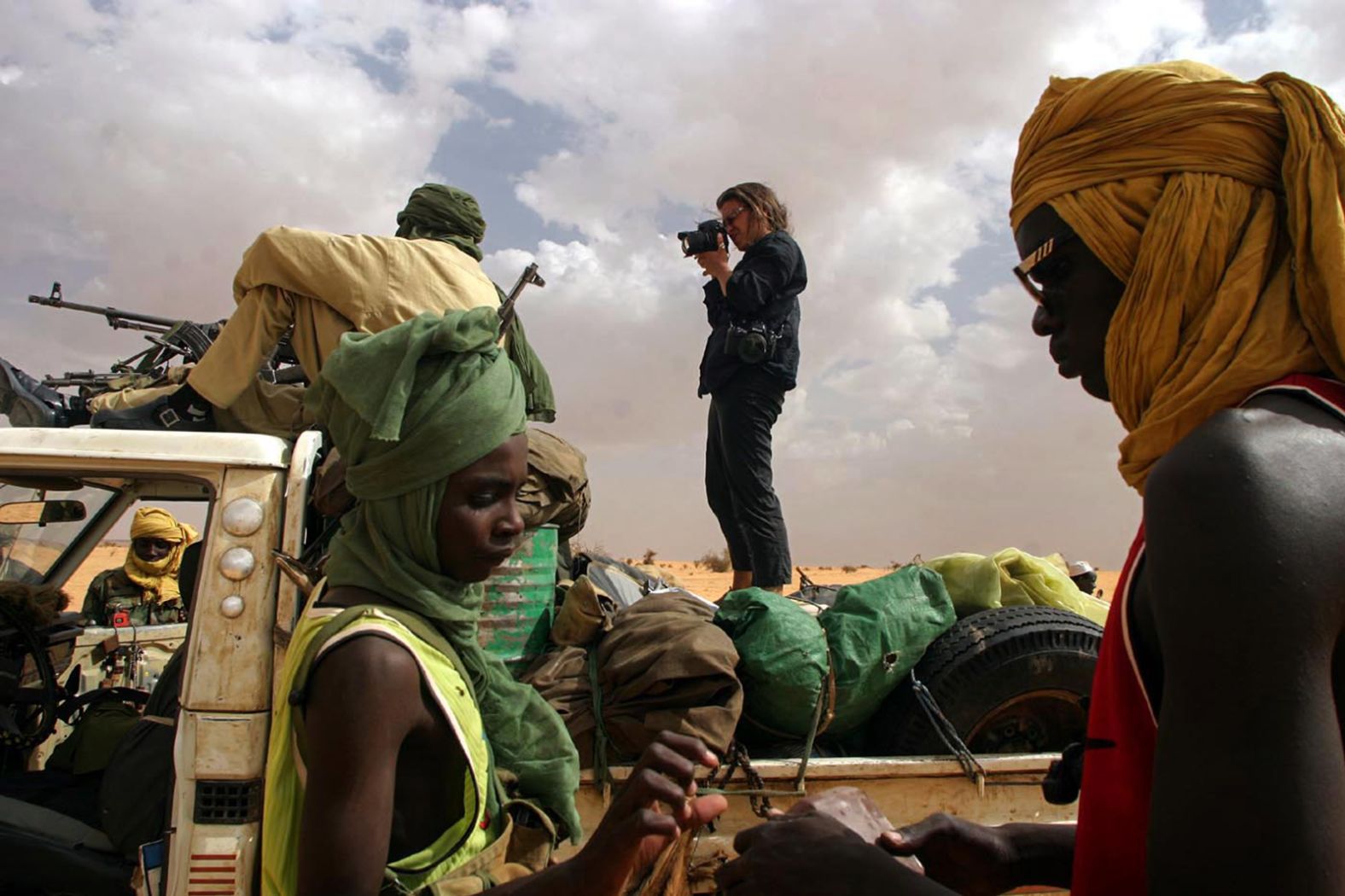 <a href="index.php?page=&url=http%3A%2F%2Fwww.lynseyaddario.com%2F" target="_blank" target="_blank">Lynsey Addario</a> photographs rebels in Sudan's Darfur region in 2004. Addario has covered conflicts and humanitarian crises in many countries, including Afghanistan, Iraq, Libya, Syria and Somalia. Her work in Afghanistan contributed to a Pulitzer Prize that The New York Times won in 2009 for international reporting. Addario has been kidnapped twice while working in war zones. Her memoir, "It's What I Do," was a New York Times best-seller. 