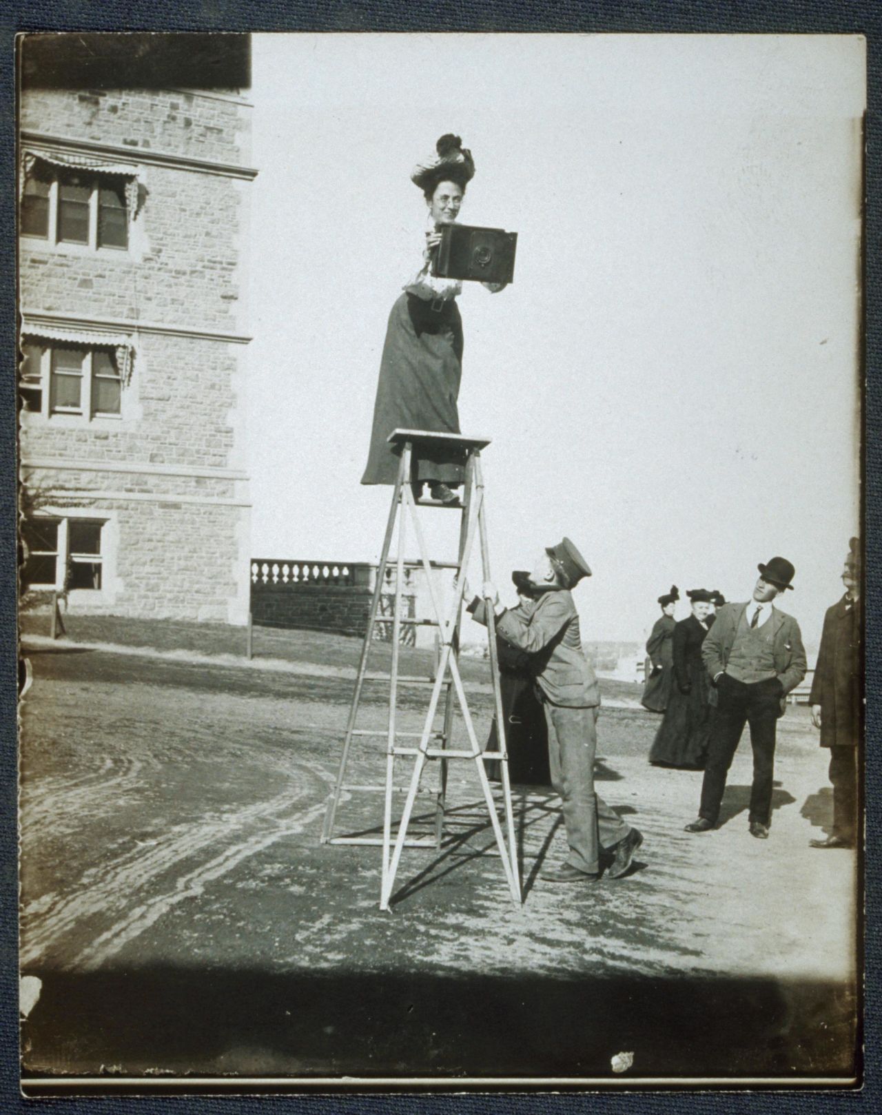 Jessie Tarbox Beals was hired by the Buffalo Inquirer in 1901, making her the first woman staff photographer at an American newspaper. She is also known for her work at the World's Fair in 1904, where she took photos atop ladders and from hot-air balloons. "If one is the possessor of health and strength, a good news instinct ... a fair photographic outfit and the ability to hustle, which is the most necessary qualification, one can be a news photographer," she told a St. Louis newspaper.