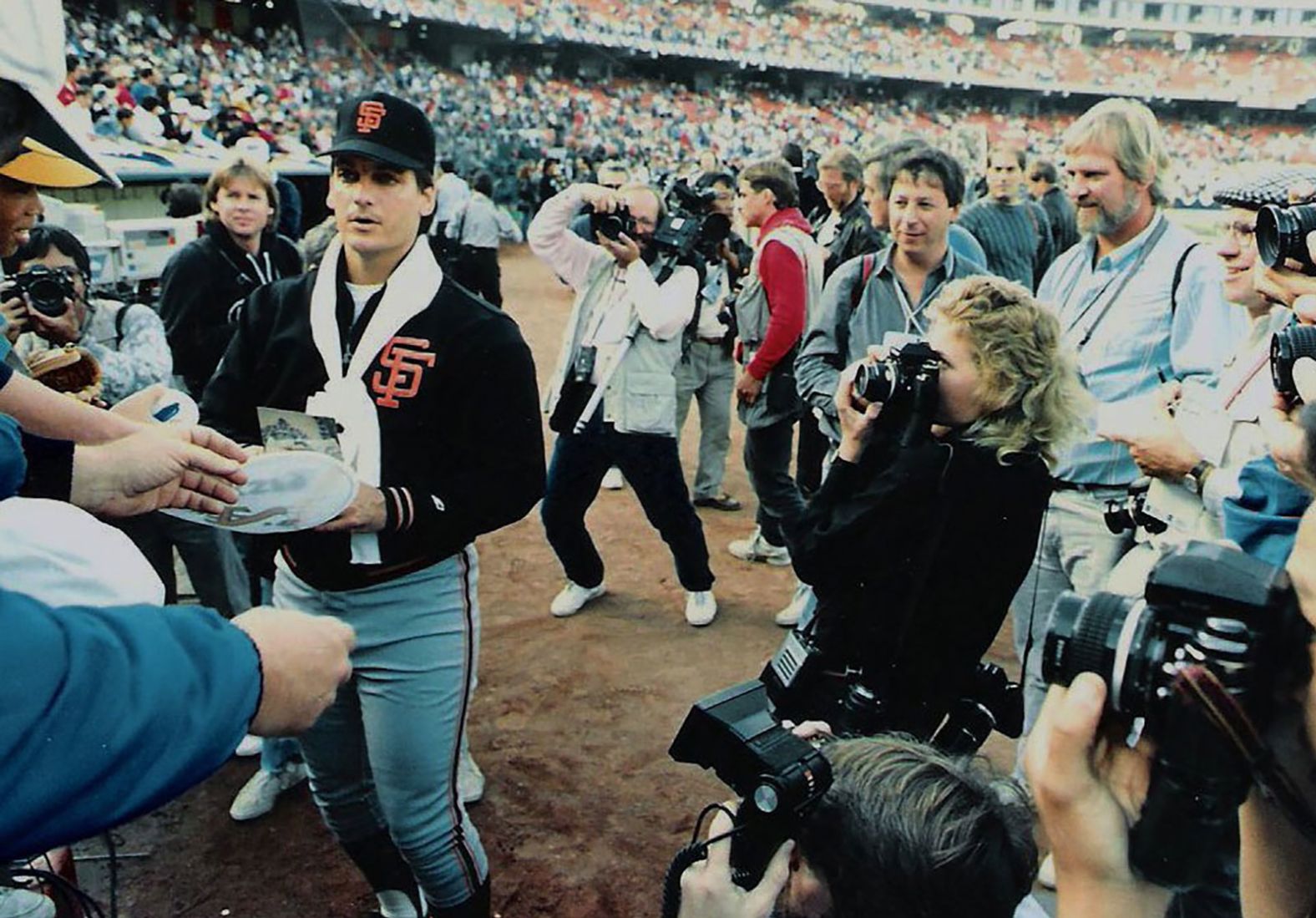 Karen T. Borchers takes a photo of San Francisco Giants pitcher Dave Dravecky during the 1989 World Series. That was the World Series that was interrupted by the Loma Prieta earthquake. Borchers was working for the San Jose Mercury News at the time, and the newspaper's coverage of the quake won a Pulitzer Prize. Borchers worked for the Mercury News from 1982 until her retirement in 2012.