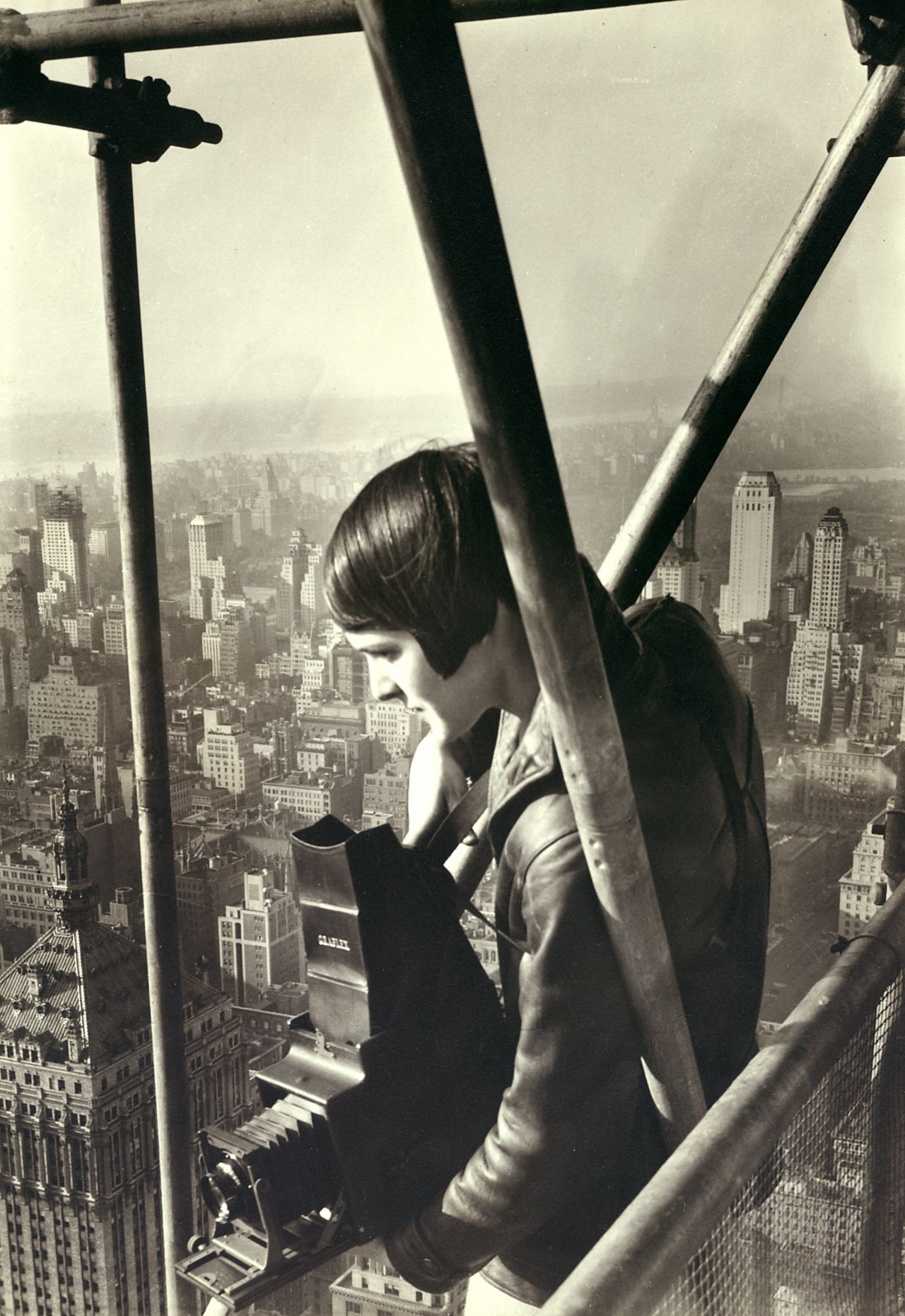 Margaret Bourke-White takes a photo atop a New York City building in 1931. She was working for Fortune magazine at the time, and she was the publication's first staff photographer. Over her career, Bourke-White compiled many more firsts. She was the first woman to be hired as a photojournalist for Life magazine. She was the first professional photographer from the West to be permitted into the Soviet Union. And she was the first female war correspondent credentialed to work in combat zones during World War II. 