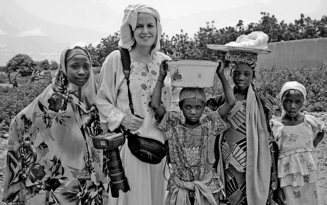 Mary F. Calvert works on a story about polio while in Nigeria in 2010. 