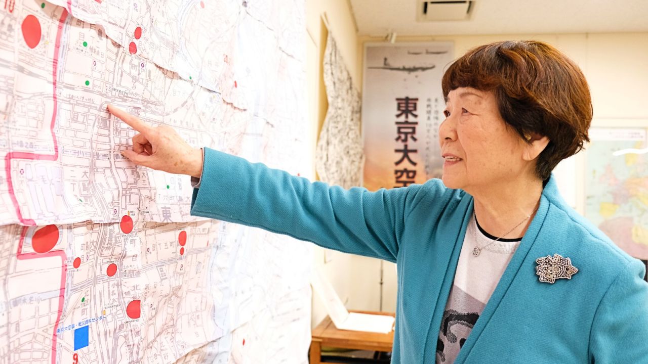 Haruyo Nihei, a survivor of the deadliest single bombing raid in human history, looks at maps at Tokyo Air Raids Center for War Damages