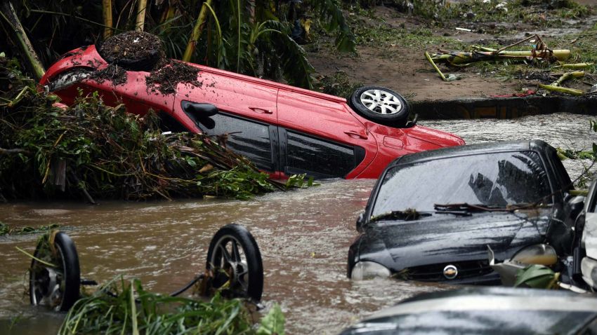 TOPSHOT - View of cars stuck in the water and mud, after heavy rains during the weekend in Realengo neighbourhood, in the suburbs of Rio de Janeiro, Brazil, on March 2, 2020. (Photo by MAURO PIMENTEL / AFP) (Photo by MAURO PIMENTEL/AFP via Getty Images)