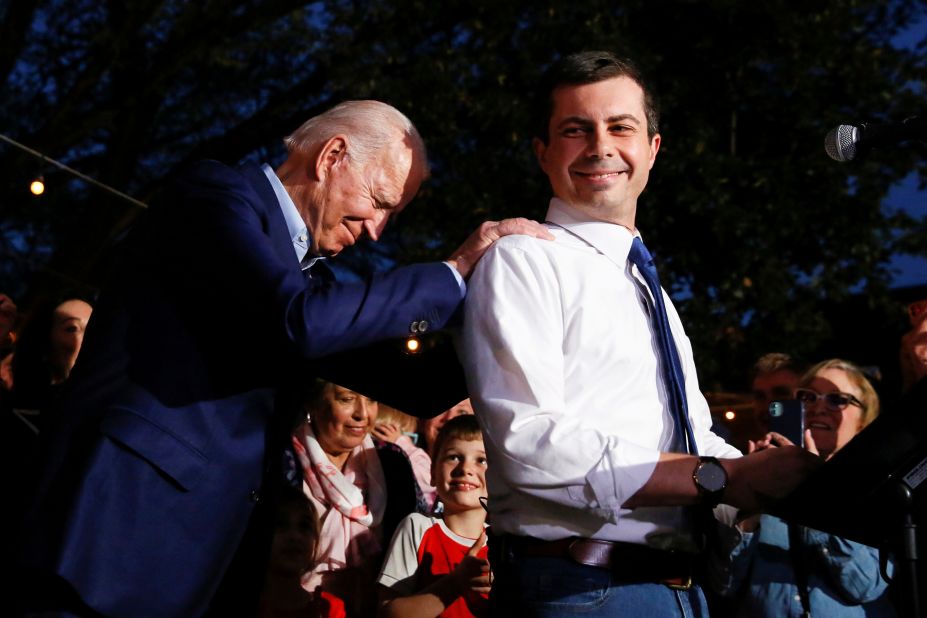 Biden puts his hands on the shoulders of Pete Buttigieg as Buttigieg <a href="https://www.cnn.com/2020/03/02/politics/pete-buttigieg-endorsement-obama-biden-calls/index.html" target="_blank">endorses him for president</a> in March 2020. Buttigieg, the former mayor of South Bend, Indiana, had just dropped out of the Democratic race.