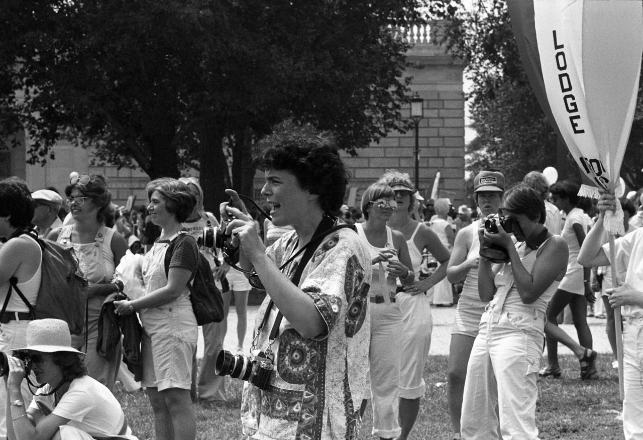 Joan E. Biren is seen in the foreground as she photographs the Equal Rights Amendment March in Washington in 1978. Biren, aka JEB, has been documenting the LGBTQ community for decades. 