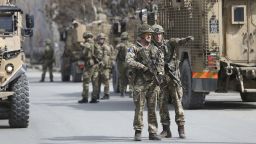British soldiers with NATO-led Resolute Support Mission forces arrive near the site of an attack in Kabul, Afghanistan, Friday, March 6, 2020. Gunmen in Afghanistan's capital of Kabul attacked a remembrance ceremony for a minority Shiite leader on Friday, wounding more than a dozen of people, officials said. (AP Photo/Rahmat Gul)