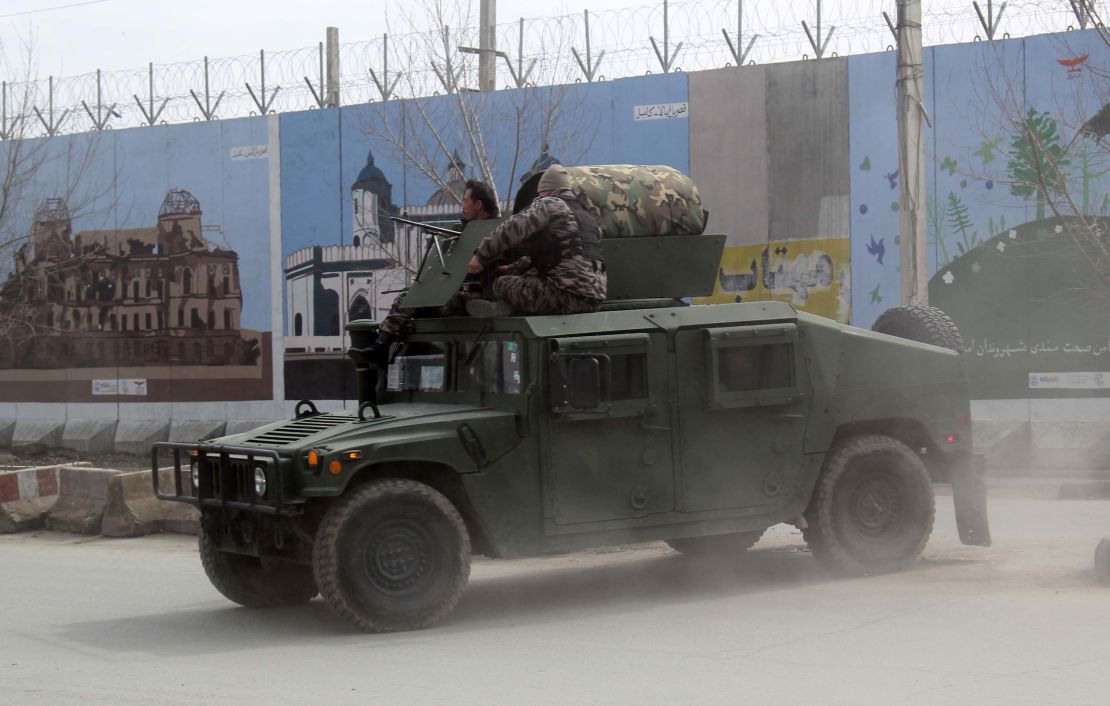 Afghan security forces patrol after Friday's attack in Kabul.