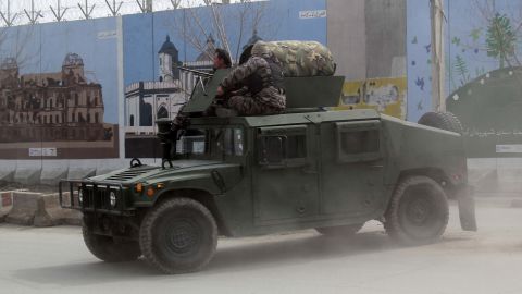 Afghan security forces patrol after Friday's attack in Kabul.