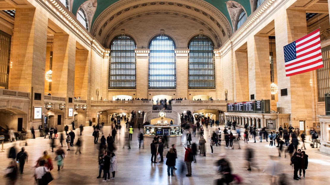 People walk through Grand Central Terminal, a major transit hub. 