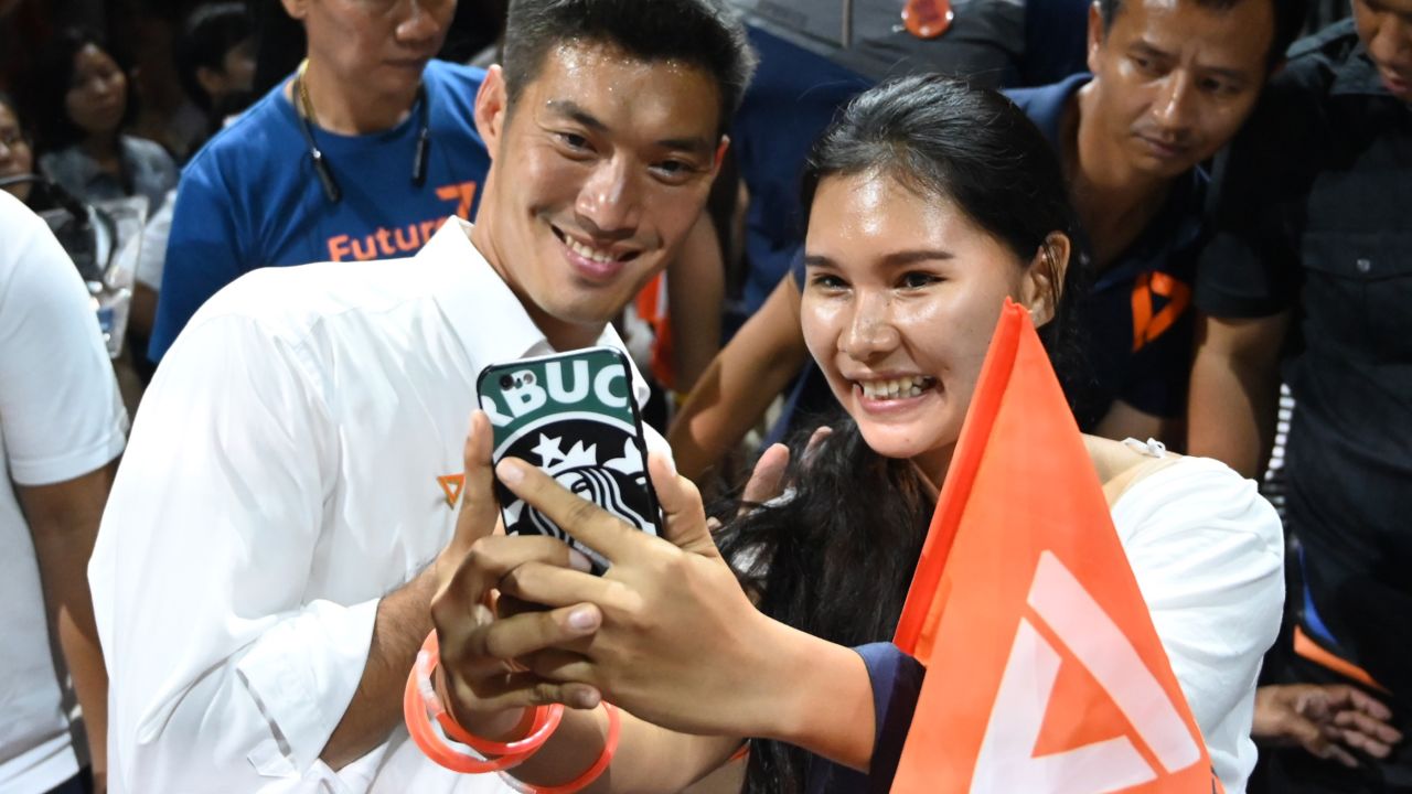 Future Forward Party leader Thanathorn Juangroongruangkit takes a selfie with a supporter in Bangkok on March 22, 2019.