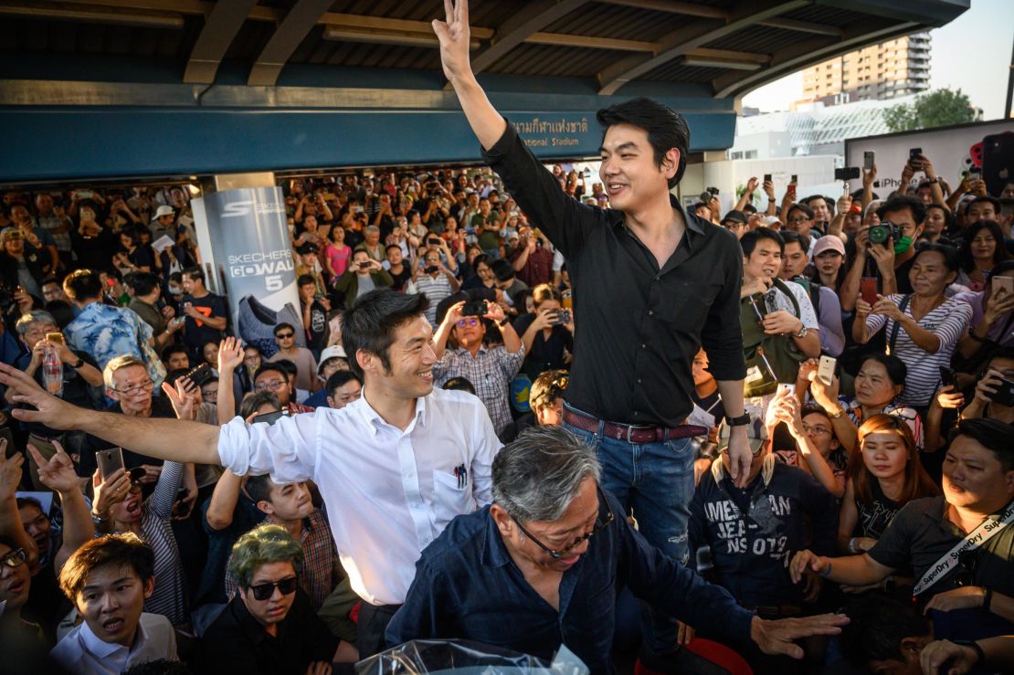 Thanathorn Juangroongruangkit and Future Forward's Secretary General Piyabutr Saengkanokkul during an unauthorised flash mob rally in downtown Bangkok in December. 