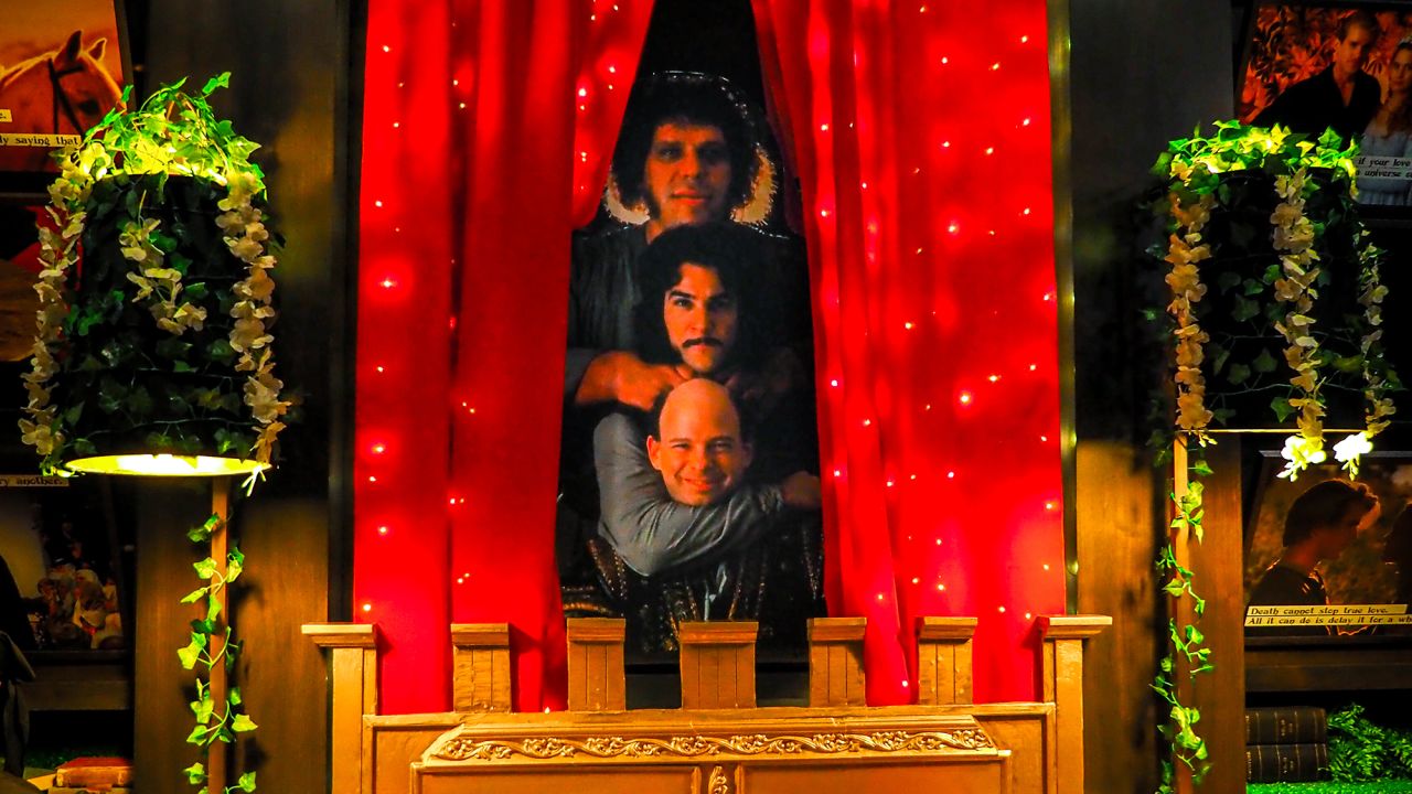A backdrop of characters Inigo Montoya, Vizzini and Fezzik ornaments one side of the lounge area.