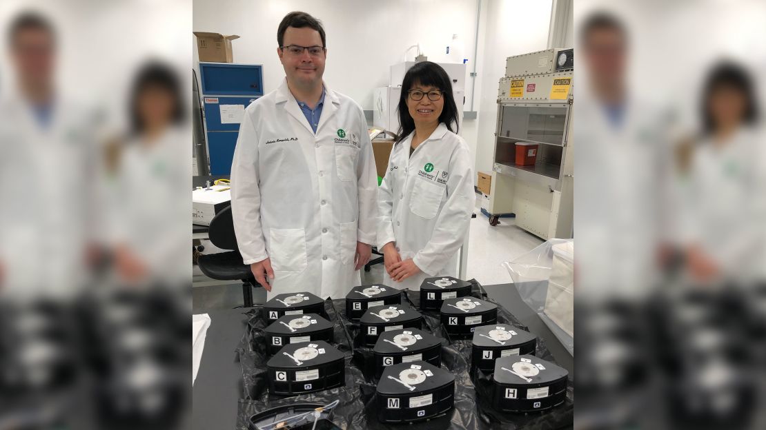 Chunhui Xu and Antonio Rampoldi, a postdoctoral fellow at Emory University, pack their Multi-use Variable-gravity Platform experiment modules containing their samples before launch.